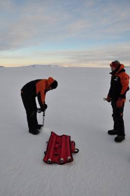 Drilling a hole to measure ice thickness (Custom).jpg