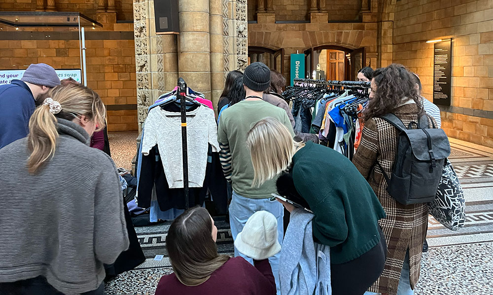 Natural History Museum staff participating in a clothes swap held in the main hall