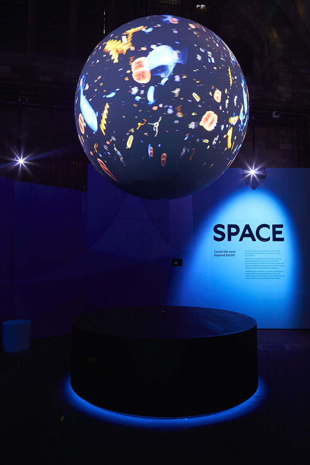 A sphere simulating a planet floats above our space exhibition