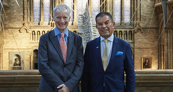 Two men stand in Hintze Hall