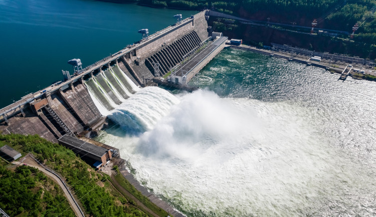 Water flows through a hydroelectric dam.