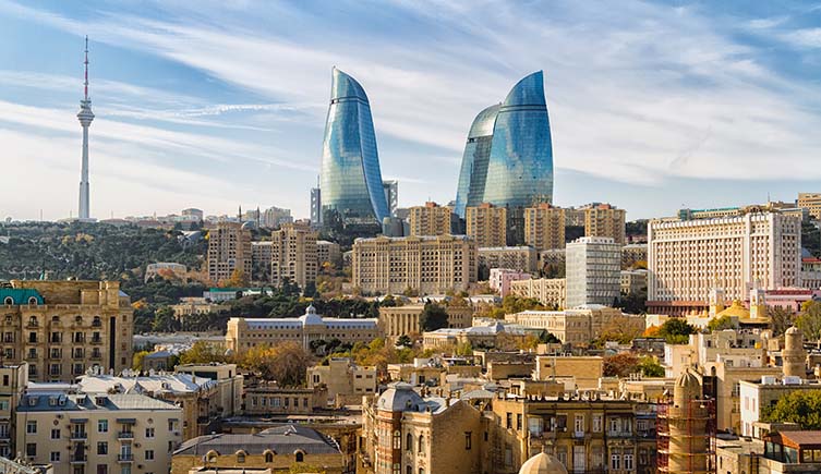 A picture of Baku in Azerbaijan, with large modern building behind older structures.