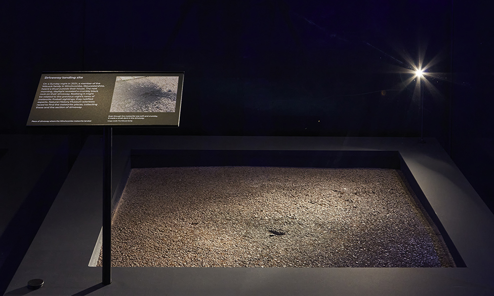 A piece of pavement from the driveway in Winchcombe, Gloucestershire is seen behind glass