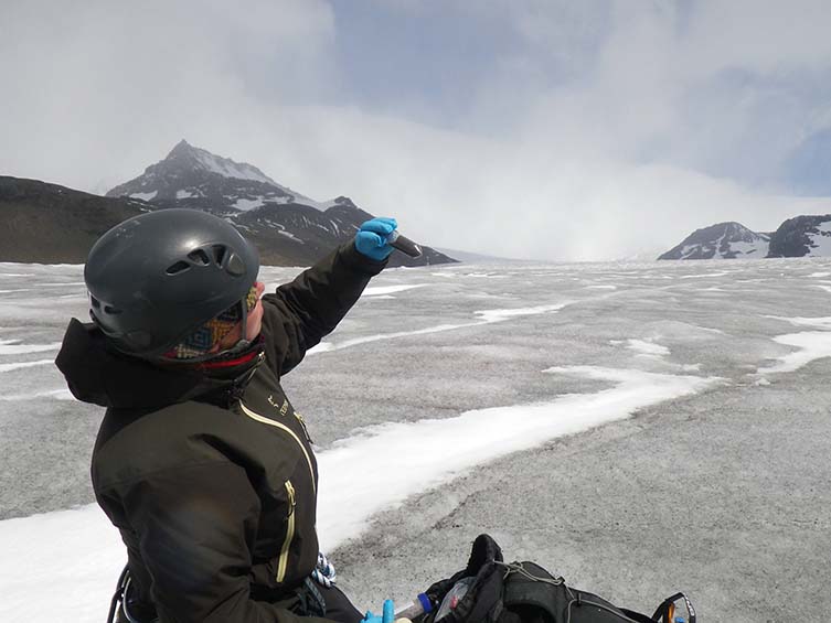 Dr Anne D Jungblut takes samples from the glacier
