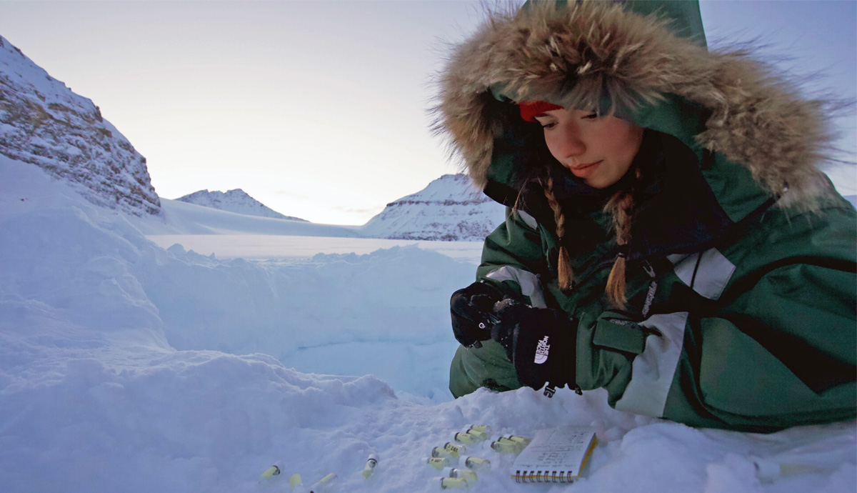 Laura taking samples from beneath the snow.