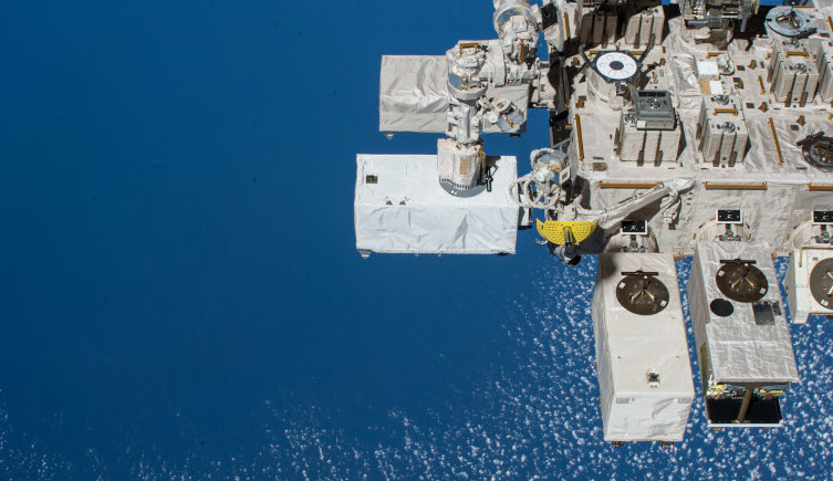 The ECOSTRESS instrument attached to the International Space Station over the ocean.