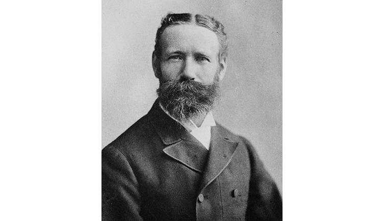 A black and white photo portrait of William Saville-Kent 