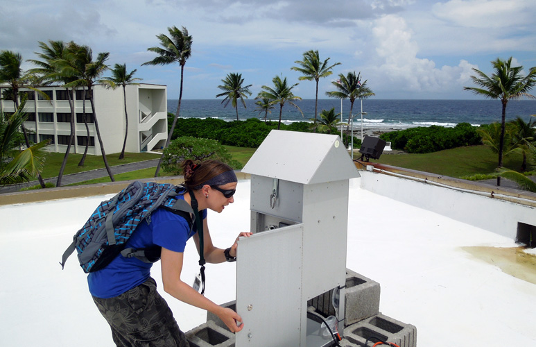 Penny Wozniakiewicz collecting samples from the dust sampler on Kwajalein atoll.