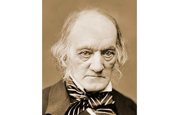 A photograph of Richard Owen in a suit with a striped tie.