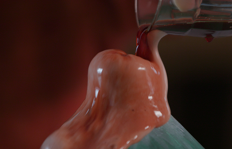 Coloured vinegar is poured into a bottle inside a painted paper volcano. The vinegar reacts with bicarbonate causing a foamy reaction to spew from the bottle. 