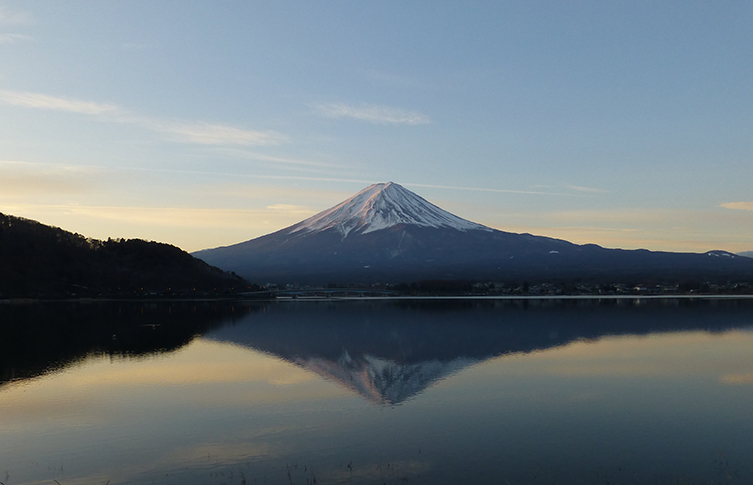 A view of Mount Fuji from across a lake.
