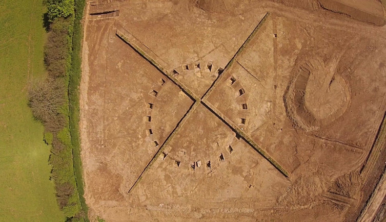 An aerial view of a Bronze Age round barrow taken at Sherford