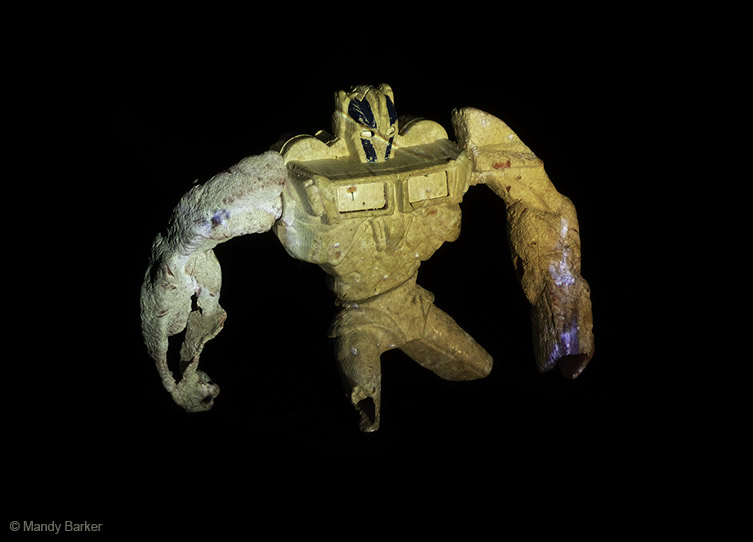 A yellow Happy Meal toy, from the Transformers series.