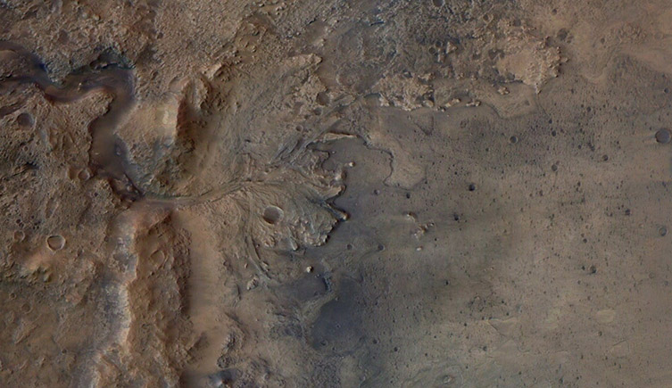 An aerial view of the Jezero Crater on Mars, showing the fan-like shape of a river delta. 
