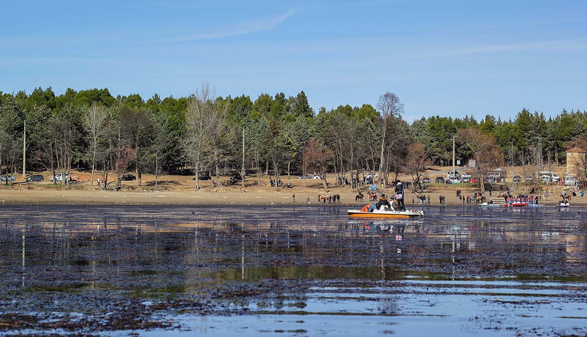 Holidaymakers ride pedalos and horses at Lake Aoua.