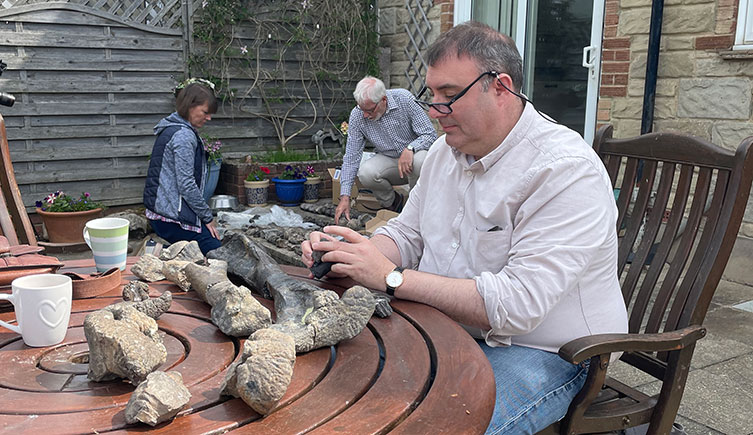 Paul Barrett, Susie Maidment and Jeremy Lockwood inspecting dinosaur bones