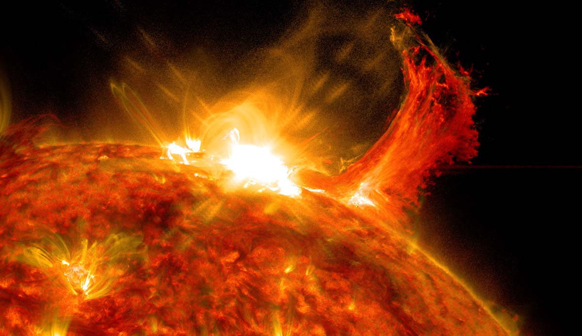 A solar flare erupts from the surface of the Sun.