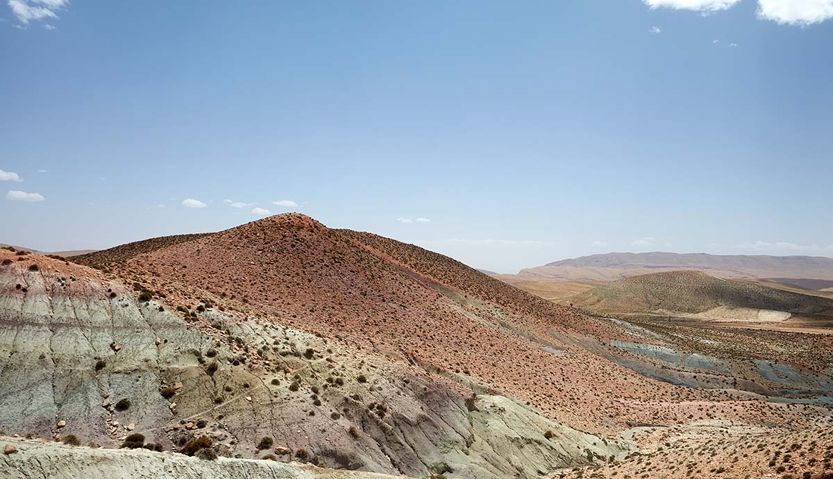 Rocky outcrops and slopes stretch into the distance in the Middle Atlas mountains.
