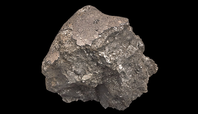 A picture of the Ivuna meteroite, showing its metallic, almost coppery colour.  