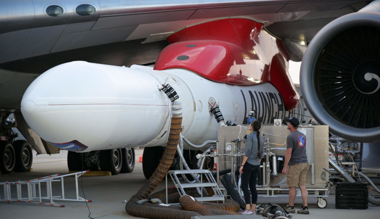 The LauncherOne rocket is attached to Cosmic Girl's wing