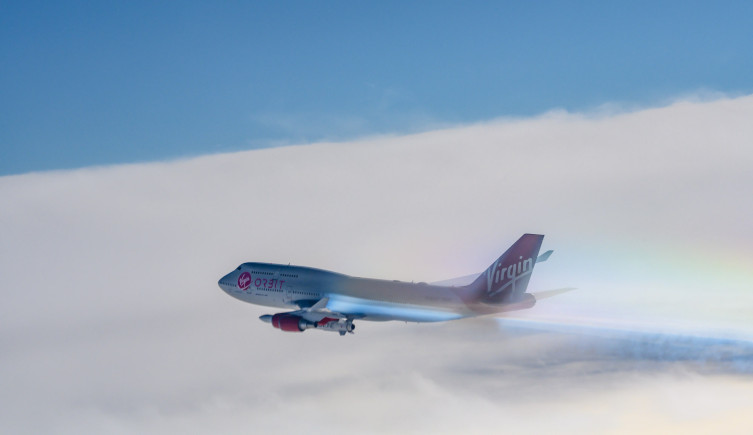 Cosmic Girl, with LauncherOne attached, flies through the clouds