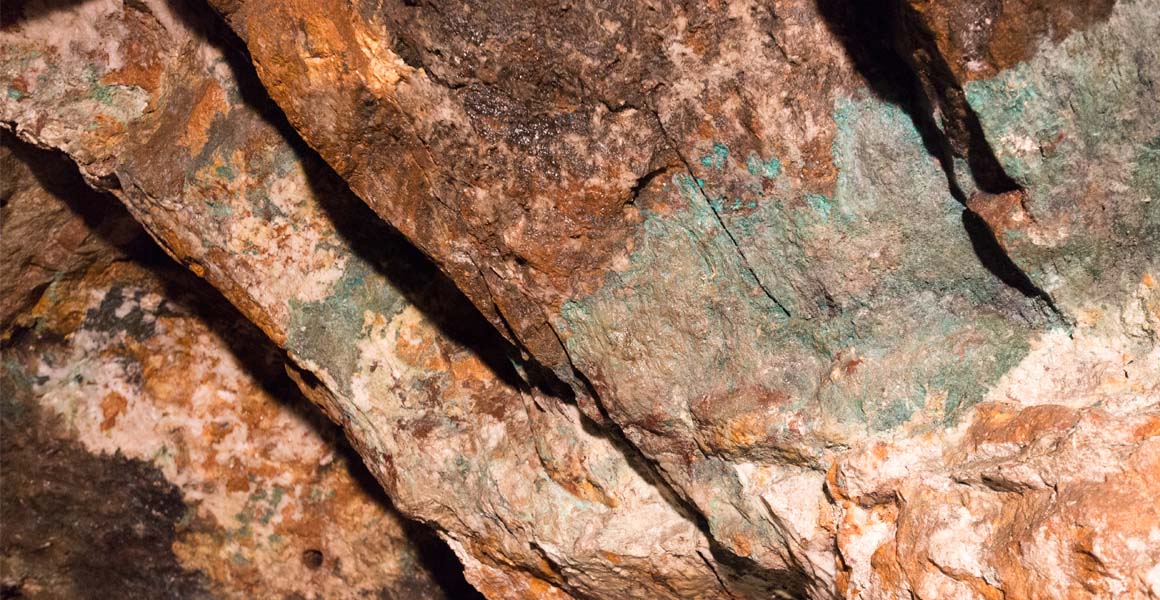 Copper ore within the rock in a mine.