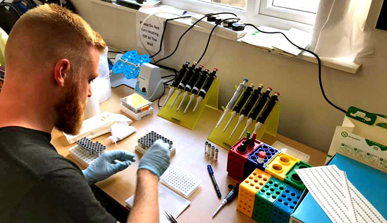 A Museum staff scientist working with eDNA sample vials