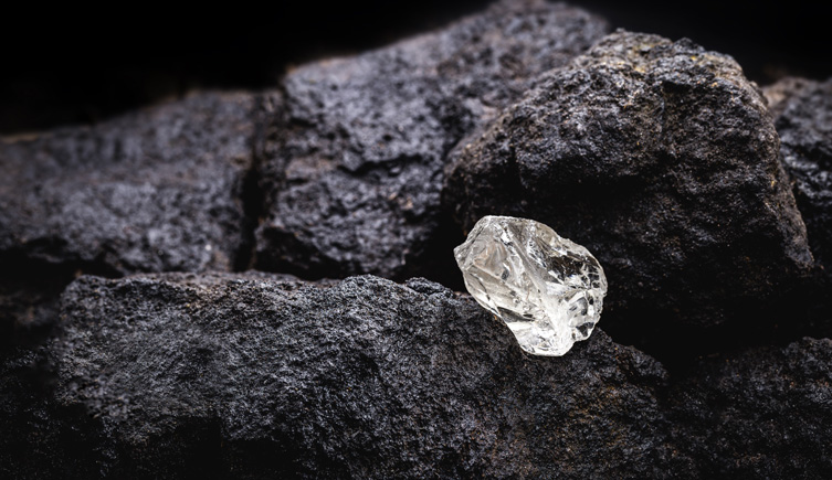 Image of an uncut diamond in rock