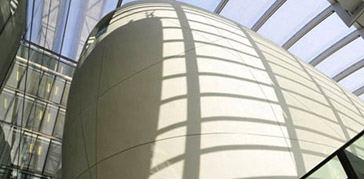 A photo of the exterior of the cocoon, a large white rounded building
