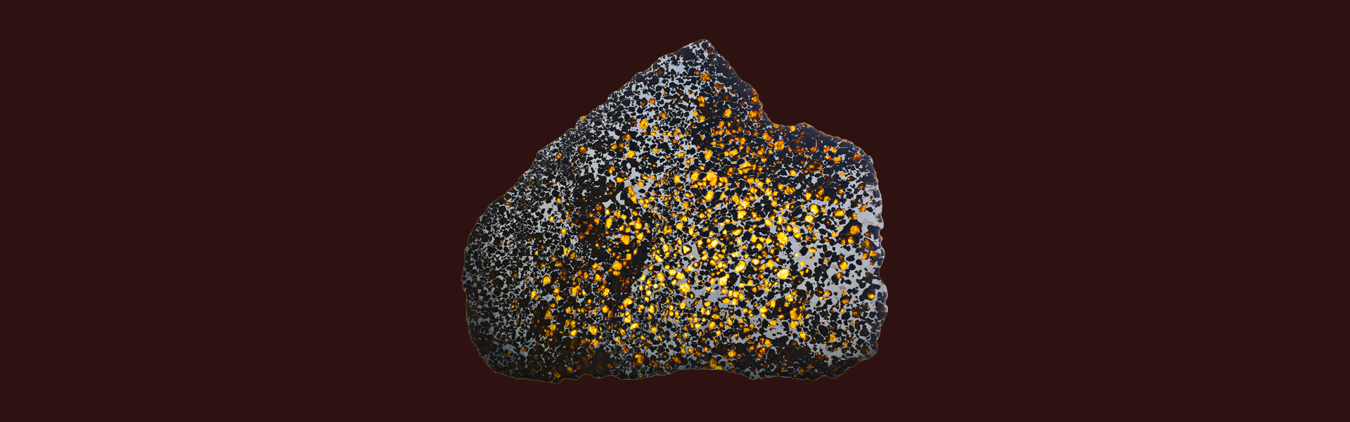 A meteorite over a brown background