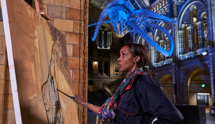 Celebrity painting at an easel in Hintze Hall 