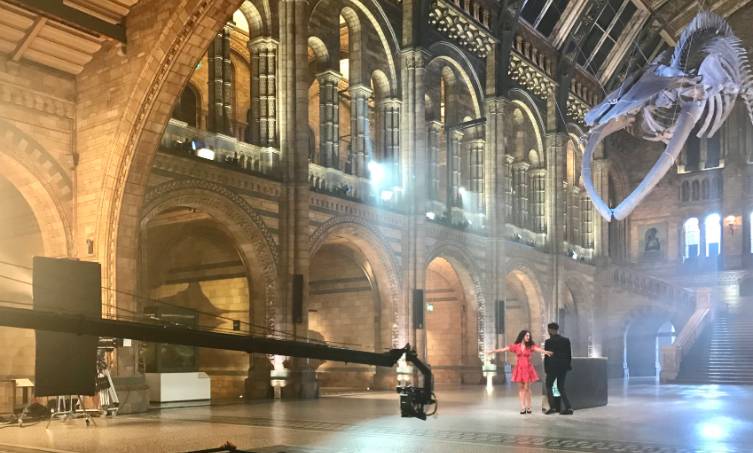 Flirty Dancing filming with two dancers under Hope the blue whale in Hintze Hall