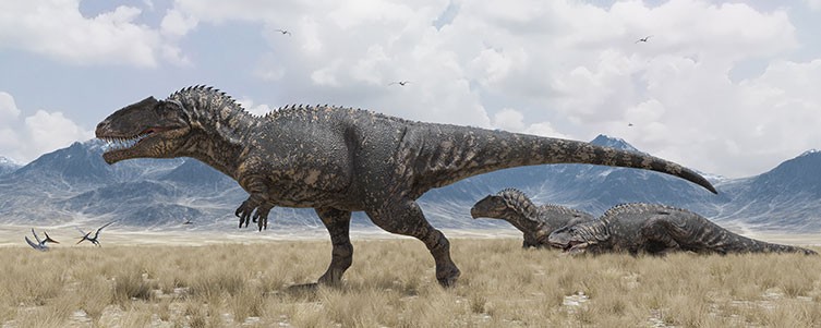 Three Giganotosaurus dinosaurs in an open landscape
