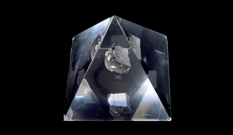 A piece of moon rock in a glass prism