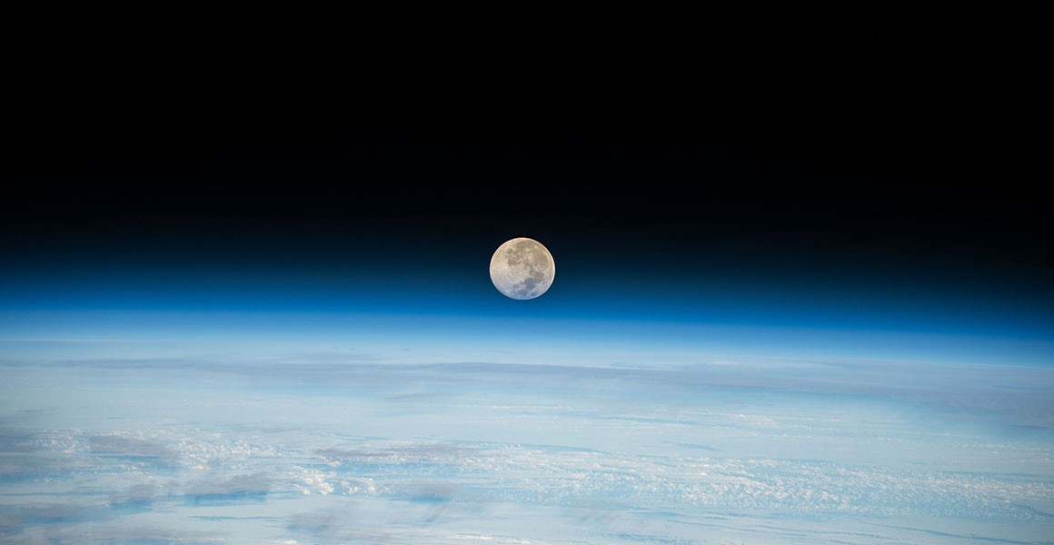 A picture of the Moon setting behind Earth's horizon