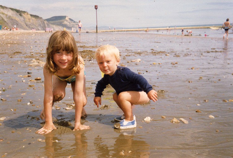 Susie Maidment and her brother on the beach