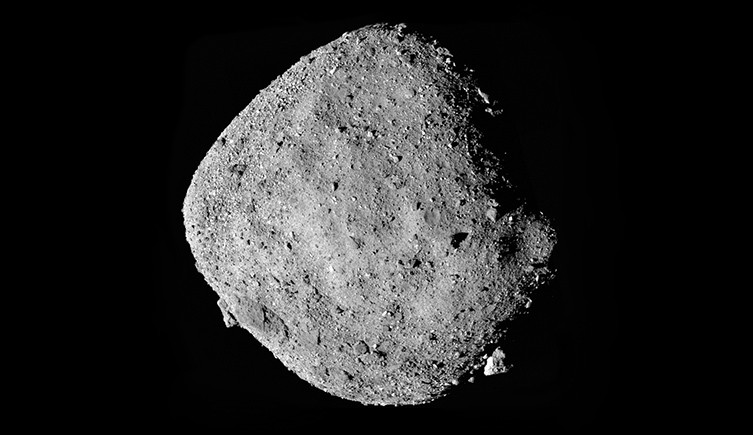 A composite picture showing the asteroid Bennu, with a grey rocky surface on a black background of space. 